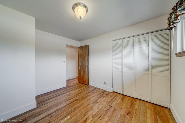 1003 W Eastmont Way, Spokane, WA 99208 - unfurnished bedroom with light wood-style floors and a closet