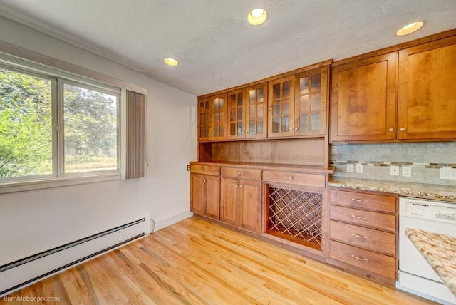 1003 W Eastmont Way, Spokane, WA 99208 - bar area featuring dishwasher, baseboard heating, tasteful backsplash, light wood-style floors, and recessed lighting
