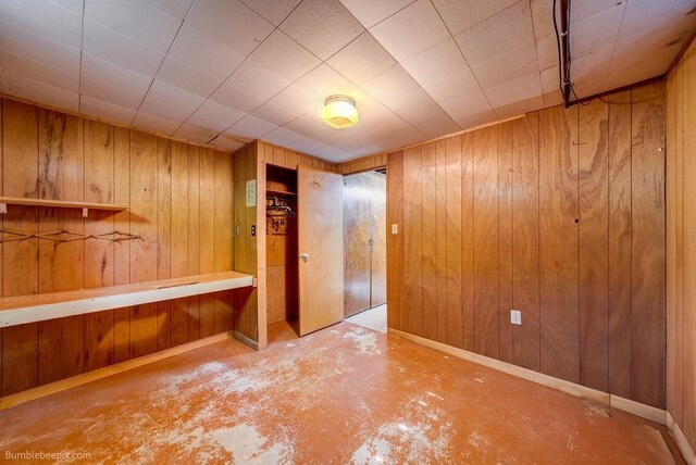 1003 W Eastmont Way, Spokane, WA 99208 - unfurnished room featuring concrete flooring and wood walls