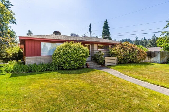 1003 W Eastmont Way, Spokane, WA 99208 - view of front of house with brick siding, a chimney, and board and batten siding