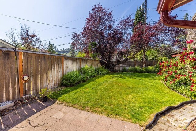 1003 W Eastmont Way, Spokane, WA 99208 - fenced backyard featuring a patio