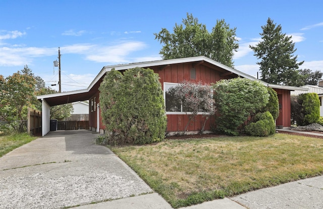 5804 N Maple St, Spokane, WA 99205 - view of home's exterior with board and batten siding, concrete driveway, and an attached carport