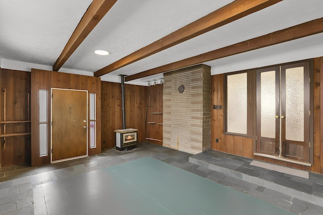 5804 N Maple St, Spokane, WA 99205 - below grade area featuring a wood stove and wood walls