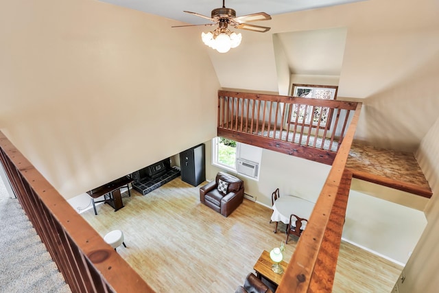 882 Diamond Creek Rd, Newport, WA 99156 - living area with ceiling fan, high vaulted ceiling, wood finished floors, a baseboard heating unit, and a wall mounted AC