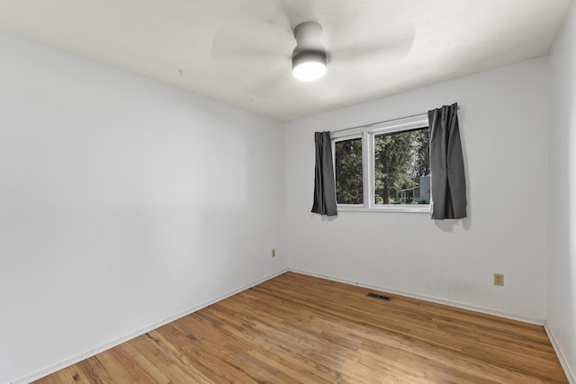 812 W Westover Rd, Spokane, WA 99218 - empty room with light wood-style floors and a ceiling fan