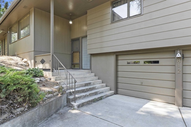 812 W Westover Rd, Spokane, WA 99218 - property entrance featuring a garage and concrete driveway