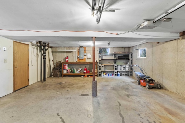 812 W Westover Rd, Spokane, WA 99218 - garage featuring a garage door opener and electric panel