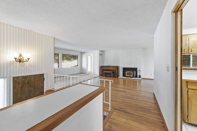 812 W Westover Rd, Spokane, WA 99218 - corridor with a textured ceiling and light wood-type flooring