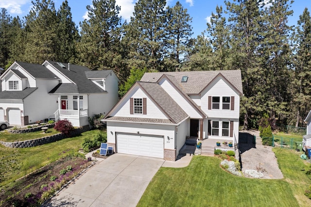 6610 S Echo Ridge St, Spokane, WA 99224 - traditional-style home featuring concrete driveway, an attached garage, a front yard, and roof with shingles
