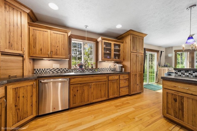 1629 S Royal St, Spokane, WA 99224 - kitchen featuring dishwasher, dark countertops, brown cabinets, a textured ceiling, and recessed lighting