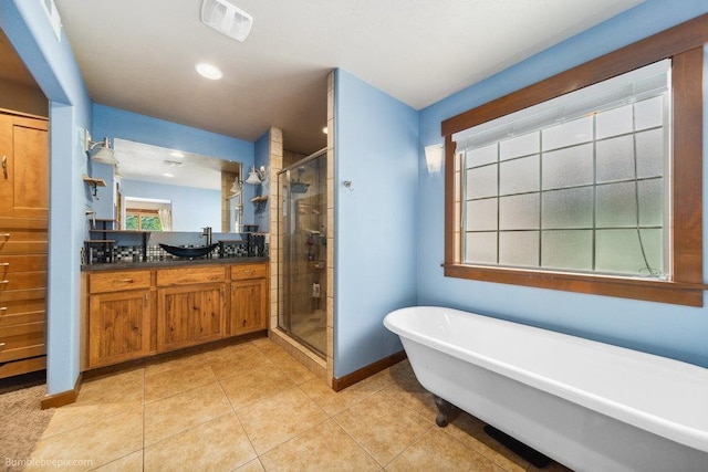 1629 S Royal St, Spokane, WA 99224 - bathroom with a shower stall, a soaking tub, vanity, tile patterned flooring, and recessed lighting