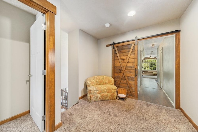 1629 S Royal St, Spokane, WA 99224 - sitting room featuring carpet floors, a barn door, and an upstairs landing