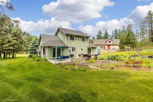 1629 S Royal St, Spokane, WA 99224 - rear view of house featuring a patio area, a storage unit, a yard, and an outdoor fire pit