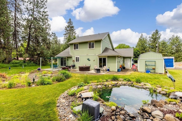 1629 S Royal St, Spokane, WA 99224 - back of property featuring a patio, a small pond, a yard, and a fire pit