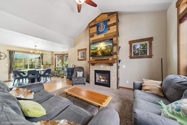 1629 S Royal St, Spokane, WA 99224 - living area with a chandelier, ceiling fan, a tiled fireplace, and vaulted ceiling