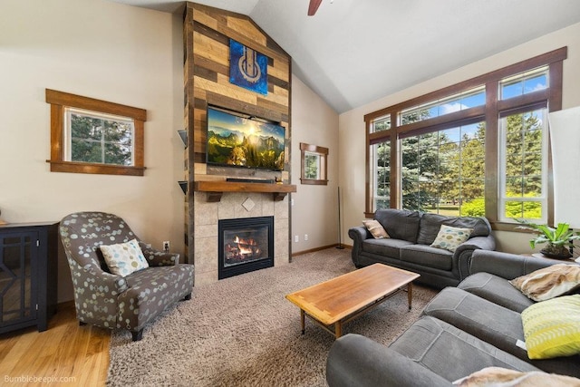 1629 S Royal St, Spokane, WA 99224 - living room with high vaulted ceiling, a tiled fireplace, and wood finished floors