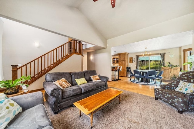 1629 S Royal St, Spokane, WA 99224 - living room featuring a chandelier, stairs, wood finished floors, ceiling fan, and high vaulted ceiling