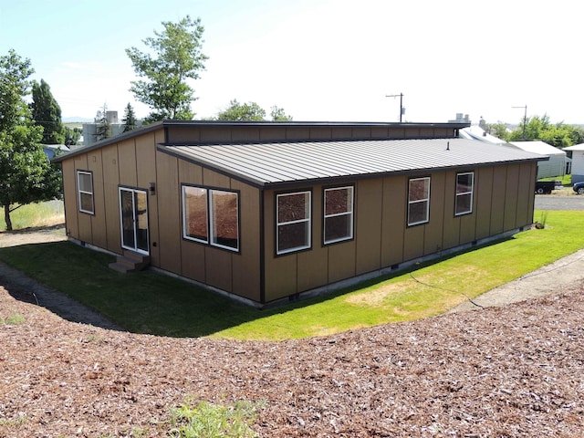 516 SW Alder St, Wilbur, WA 99185 - back of property featuring entry steps, board and batten siding, and a metal roof