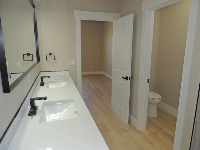 516 SW Alder St, Wilbur, WA 99185 - bathroom with wood finished floors and double vanity