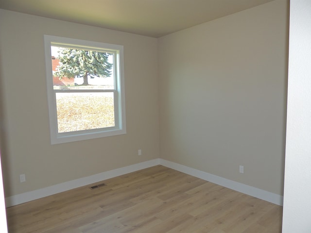 516 SW Alder St, Wilbur, WA 99185 - unfurnished room featuring light wood-style floors and baseboards