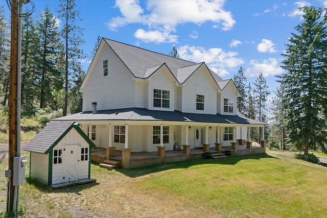 12710 E Kronquist Rd, Mead, WA 99021 - view of front of house with a storage unit, a front lawn, and a porch
