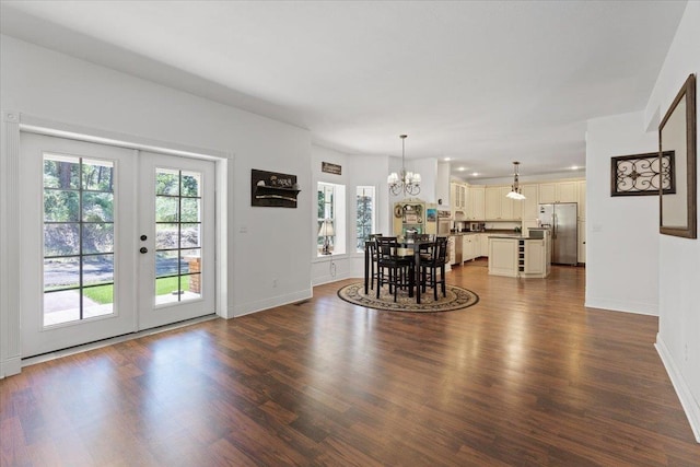 12710 E Kronquist Rd, Mead, WA 99021 - dining room featuring a chandelier, plenty of natural light, dark wood-style floors, and french doors