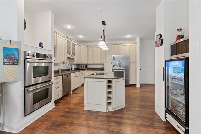 12710 E Kronquist Rd, Mead, WA 99021 - kitchen with beverage cooler, appliances with stainless steel finishes, dark countertops, cream cabinets, and open shelves