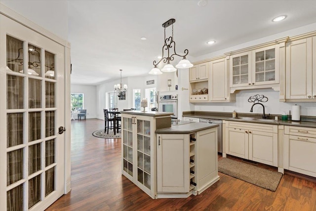 12710 E Kronquist Rd, Mead, WA 99021 - kitchen featuring stainless steel appliances, dark countertops, open shelves, cream cabinets, and recessed lighting