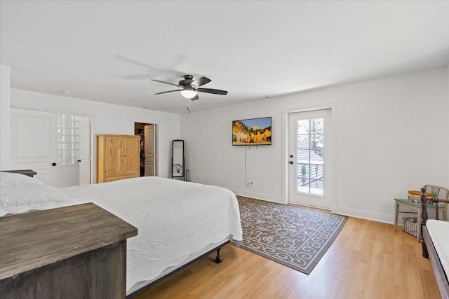 12710 E Kronquist Rd, Mead, WA 99021 - bedroom featuring wood finished floors, ceiling fan, and access to exterior