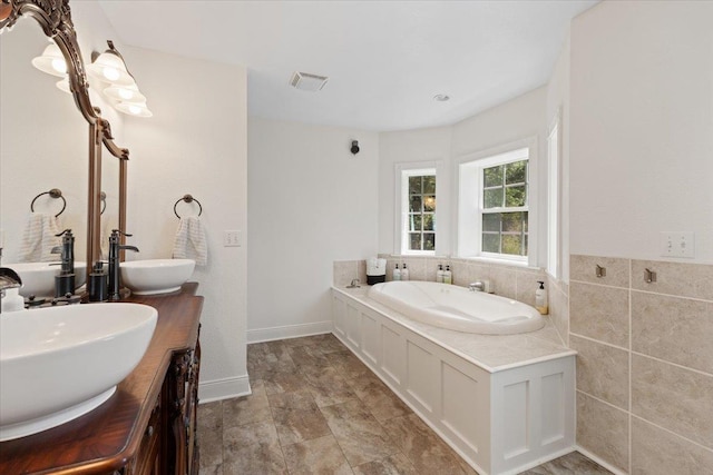 12710 E Kronquist Rd, Mead, WA 99021 - bathroom featuring a bath and double vanity