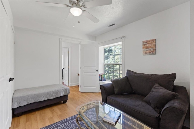 12710 E Kronquist Rd, Mead, WA 99021 - living area with light wood-style flooring and a ceiling fan