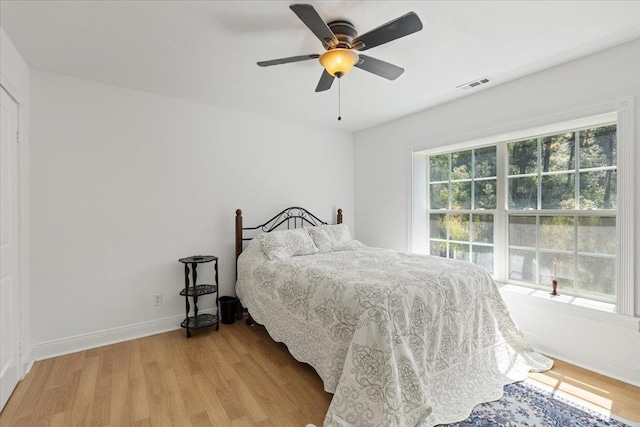12710 E Kronquist Rd, Mead, WA 99021 - bedroom with light wood-style flooring and a ceiling fan