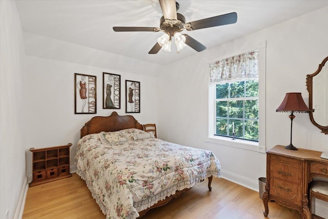 12710 E Kronquist Rd, Mead, WA 99021 - bedroom with light wood finished floors and ceiling fan