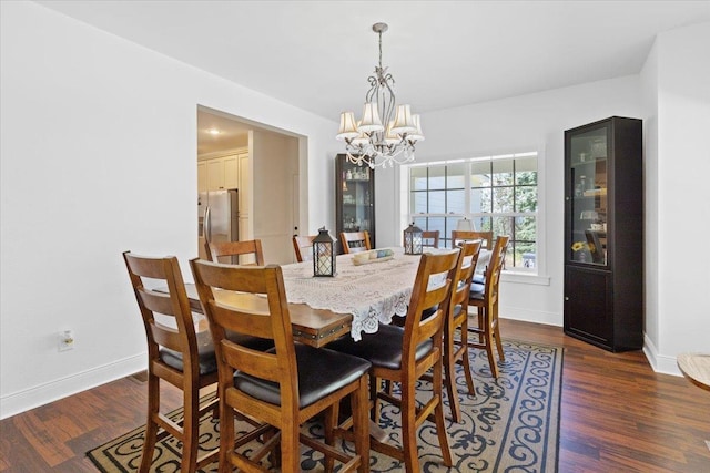 12710 E Kronquist Rd, Mead, WA 99021 - dining space featuring a chandelier and dark wood-style floors