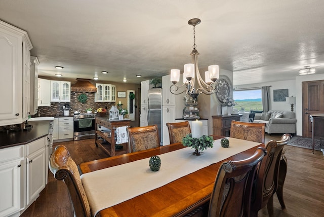 25210 E Bradshaw Rd, Fairfield, WA 99012 - dining space with a chandelier and dark wood-style floors