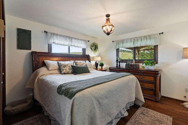 25210 E Bradshaw Rd, Fairfield, WA 99012 - bedroom featuring a chandelier, dark wood-style flooring, and electric panel