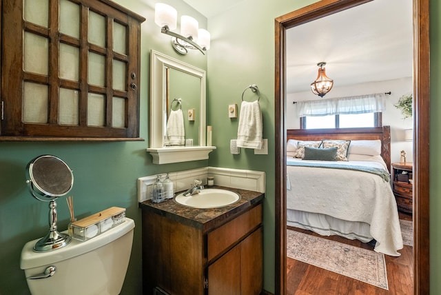25210 E Bradshaw Rd, Fairfield, WA 99012 - ensuite bathroom featuring vanity, wood finished floors, and a chandelier