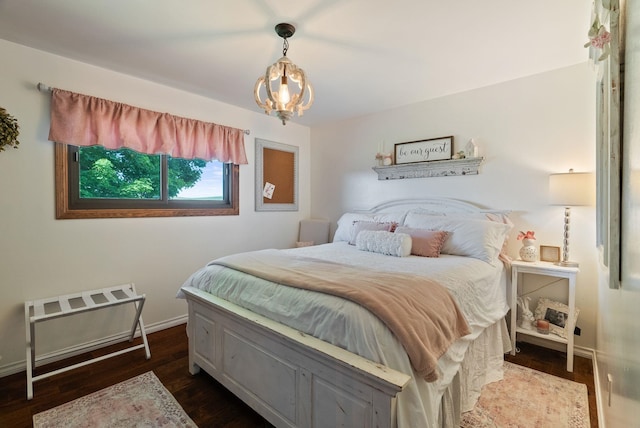 25210 E Bradshaw Rd, Fairfield, WA 99012 - bedroom featuring dark wood-style floors and a chandelier