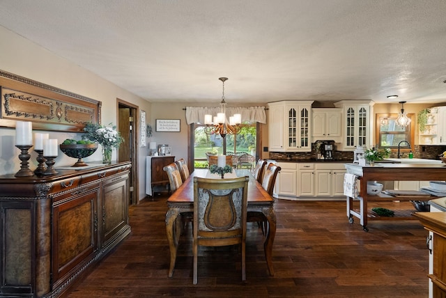 25210 E Bradshaw Rd, Fairfield, WA 99012 - dining space with a chandelier, dark wood-type flooring, and a textured ceiling