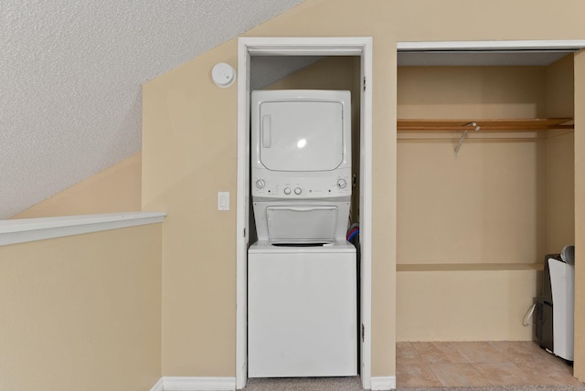 8612 N Mayfair Rd Unit 6, Spokane, WA 99208 - laundry room featuring stacked washer / drying machine and a textured ceiling