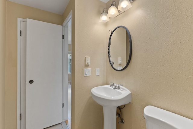 8612 N Mayfair Rd Unit 6, Spokane, WA 99208 - bathroom with toilet and a sink