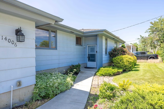14006 E Cataldo Ave, Spokane Valley, WA 99216 - property entrance featuring a lawn