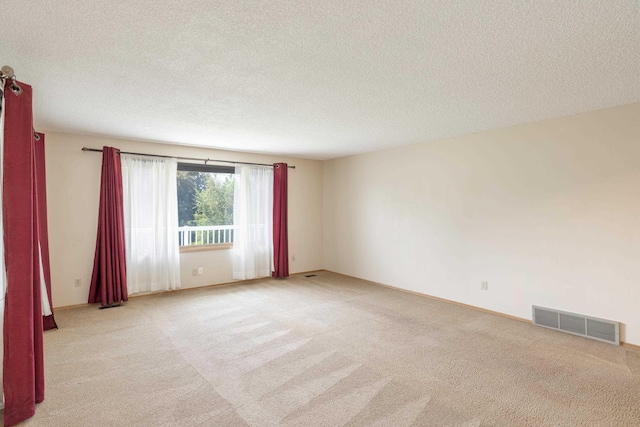 14006 E Cataldo Ave, Spokane Valley, WA 99216 - spare room featuring light colored carpet and a textured ceiling