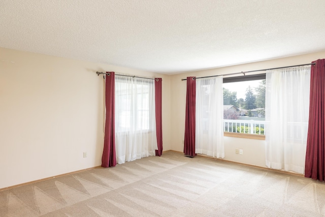 14006 E Cataldo Ave, Spokane Valley, WA 99216 - spare room featuring light carpet and a textured ceiling