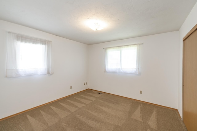 14006 E Cataldo Ave, Spokane Valley, WA 99216 - unfurnished bedroom featuring light carpet and a closet