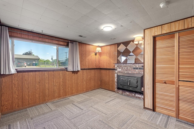 13015 E Mallon Ct, Spokane Valley, WA 99216 - unfurnished living room with wood walls and light carpet