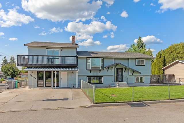 13015 E Mallon Ct, Spokane Valley, WA 99216 - view of front of home with a chimney, a fenced front yard, a balcony, and a gate