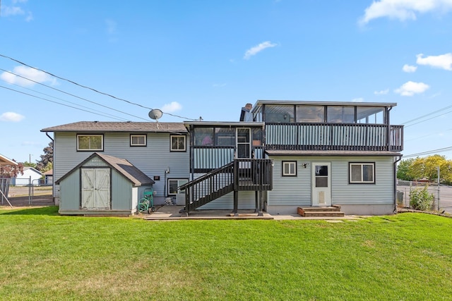 13015 E Mallon Ct, Spokane Valley, WA 99216 - rear view of house with a sunroom, a fenced backyard, a shed, and stairway