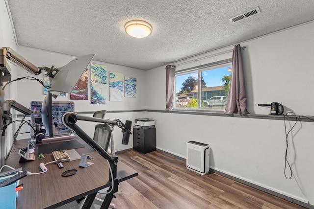 13015 E Mallon Ct, Spokane Valley, WA 99216 - exercise area with a textured ceiling and wood finished floors