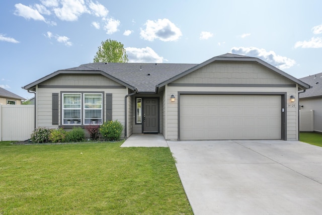 14520 E Everett Ct, Spokane Valley, WA 99216 - ranch-style home with an attached garage, concrete driveway, and a shingled roof